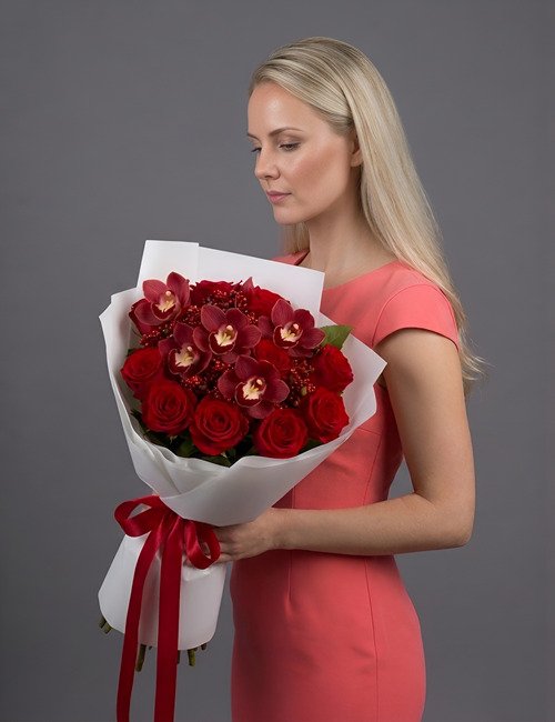 The Duchess Bouquet features Naomi Roses, cymbidium Orchids Red Valley and Red Ozothamnus